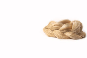 Light blond hair tress on white isolated background. Human, natural hairstyle with copy and free space. Floating border. Fashionable hairstyle for a poster, an advertisement or a hairdressing website.