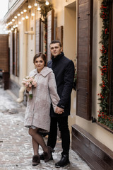 Lovers newlyweds posing for the photo in the winter