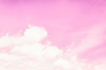 Beautiful fluffy clouds on a light pink sky background