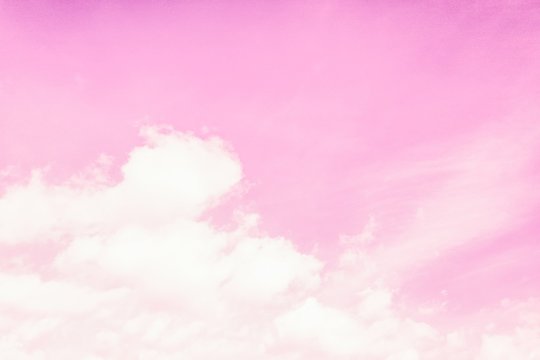 Beautiful Fluffy Clouds On A Light Pink Sky Background