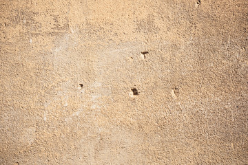 old beige background with different shades wall texture