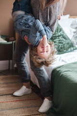 Happy young mother having fun with her child