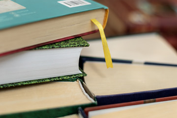 Stack of varied books many books piles
