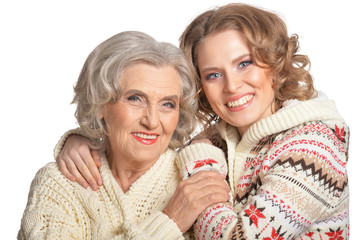 Portrait of smiling senior mother and her daughter