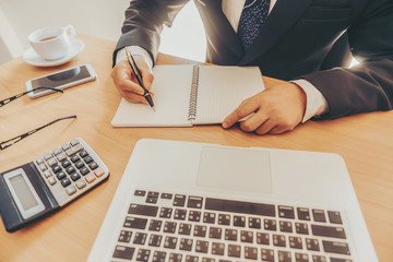 Working process startup. Businessman working at the wood table with new finance project. Modern...