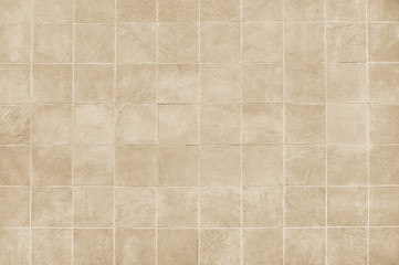 Beige tile wall background texture