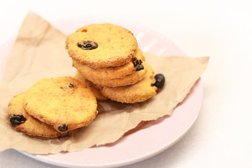 Cookies with raisins on a plate.