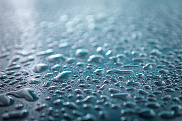 Water drops on metal surface. Abstract background