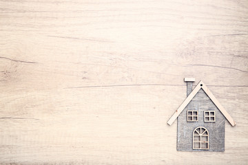 House model on wooden background
