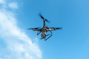 Modern beautiful dark drone in the sky.