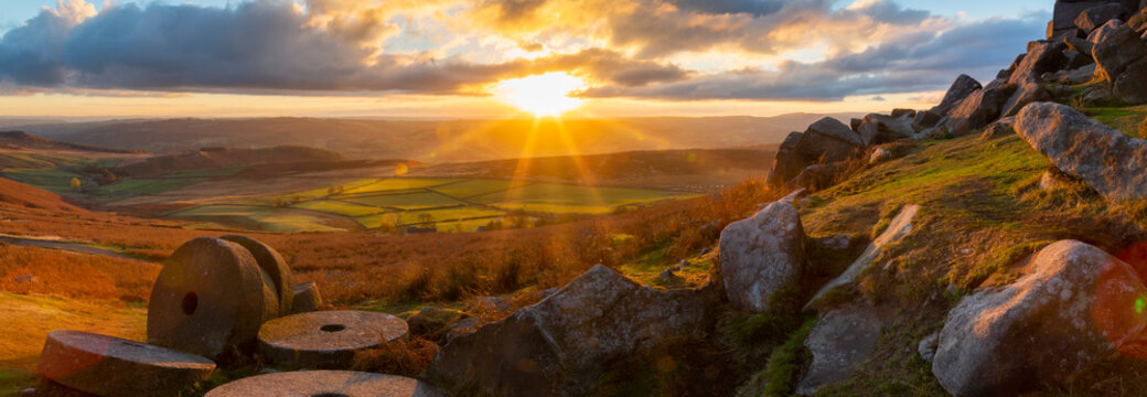 Millstones at Curbar Edge during sunset in Peak District National Park