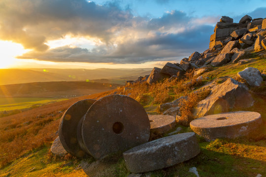 Millstones at Curbar Edge during sunset in Peak District National Park