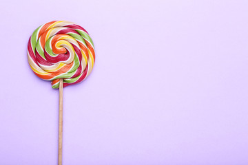 Colorful lollipop on purple background