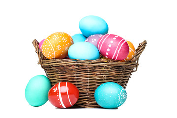 Easter eggs in basket isolated on white background