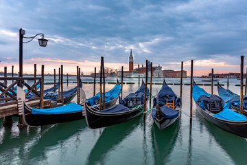 Gondolas moored in Piazza San Marco with San Giorgio Maggiore church in the background, Venice, Italy