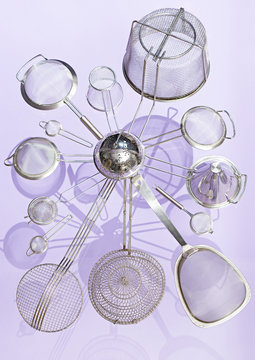 Variety of sieves against purple background