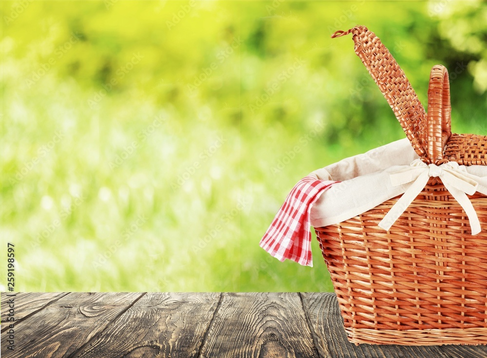 Poster Picnic Basket with napkin om nature background