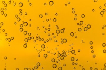Water bubbles on orange background, Beer