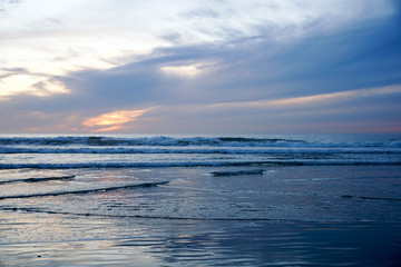 Beautiful colorful sunset over the beach and sea. Beautiful sky twilight time and reflection on the sea. peaceful moment. San Elijo State Beach, Encinitas, San Diego, California