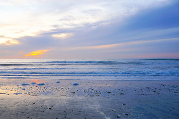 Beautiful colorful sunset over the beach and sea. Beautiful sky twilight time and reflection on the sea. peaceful moment. San Elijo State Beach, Encinitas, San Diego, California