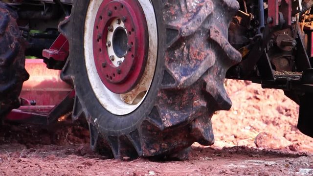 The concept of construction industry: a close up of the tractor works footage slow motion