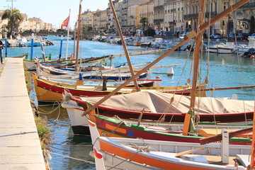 Fototapeta na wymiar Traditional boats on the royal canal in Sete, the Venice of Languedoc and the singular island in the Mediterranean sea, Herault, Occitanie, France