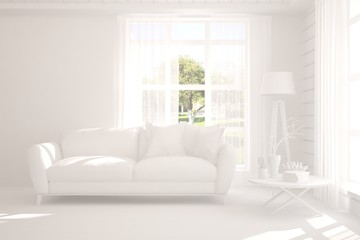 Stylish room in white color with sofa and green landscape in window. Scandinavian interior design. 3D illustration