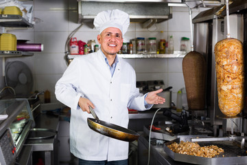 man chef serving fresh kebab