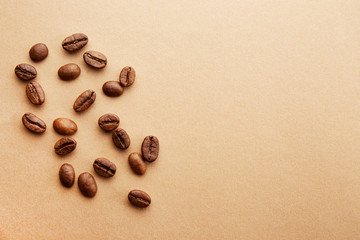 Fototapeta na wymiar Scattered coffee beans frame design on copy space background.