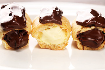 Traditional French dessert. Eclair with chocolate icing. Pastery concept with chocolate eclair