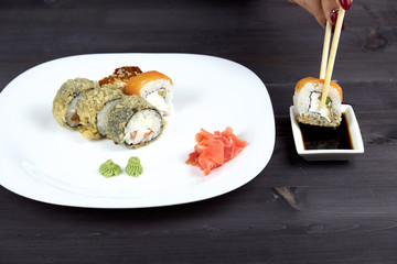 Sushi rolls on a white plate