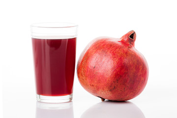Pomegranate juice with pomegranate isolated on a white background