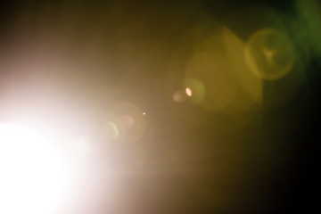 Flash of a distant abstract star. Abstract sun flare. The lens flare is subject to digital correction.