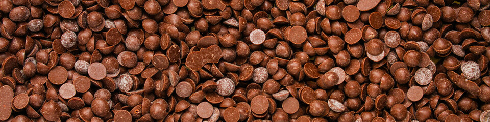 chocolate drops (sweets). food background. copy space. top