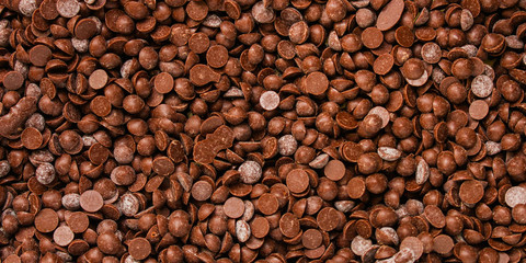 chocolate drops (sweets). food background. copy space. top