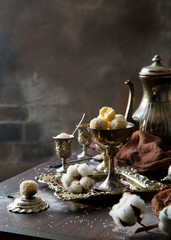 Homemade white truffle candies in coconut chips