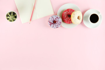 Vibrant composition of lush donut with colorful sprinkled icing, on bright background with a lot of copy space for text. Tasty but unhealthy food concept. Close up, flat lay, top view.