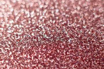 Pink glitter texture Festive sparkling sequins background closeup. Wpaper for Valentine, New Year or Christmas Holidays.