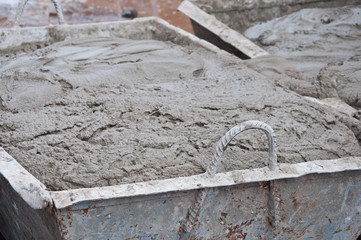 New cement in a metal tray for laying bricks