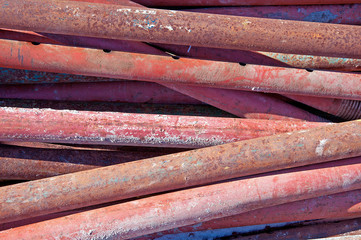Background of metal pipes in red.