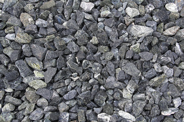 Background of stone rubble. Stone rubble as a building material.