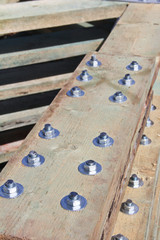 Fastening of wooden beams with bolts. Reliable fastening of large wooden beams.