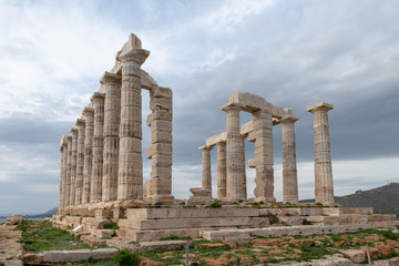 Fototapeta na wymiar Greek temple columns clouds sky angle