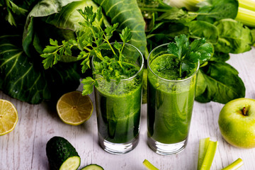 Healthy smoothie for breakfast with green spinach and apple.