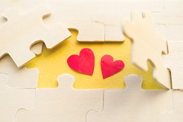 Heart and puzzles. Symbol of heart it is hidden under a part wooden puzzles. Romantic image