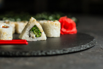 Sushi rolls different taste, rainbow color (fresh seafood) serving. Food background. Top view