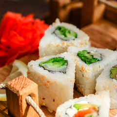 Sushi rolls different taste, rainbow color (fresh seafood) serving. Food background. Top view