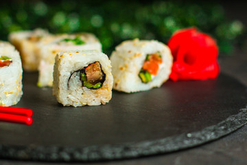 Sushi rolls different taste, rainbow color (fresh seafood) serving. Food background. Top view