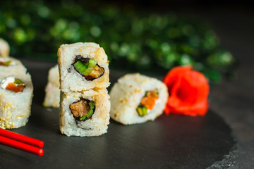 Sushi rolls different taste, rainbow color (fresh seafood) serving. Food background. Top view