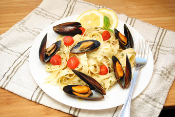 White Plated Filled Fettuccini and Atlantic Mussels & Cherry Tomatoes